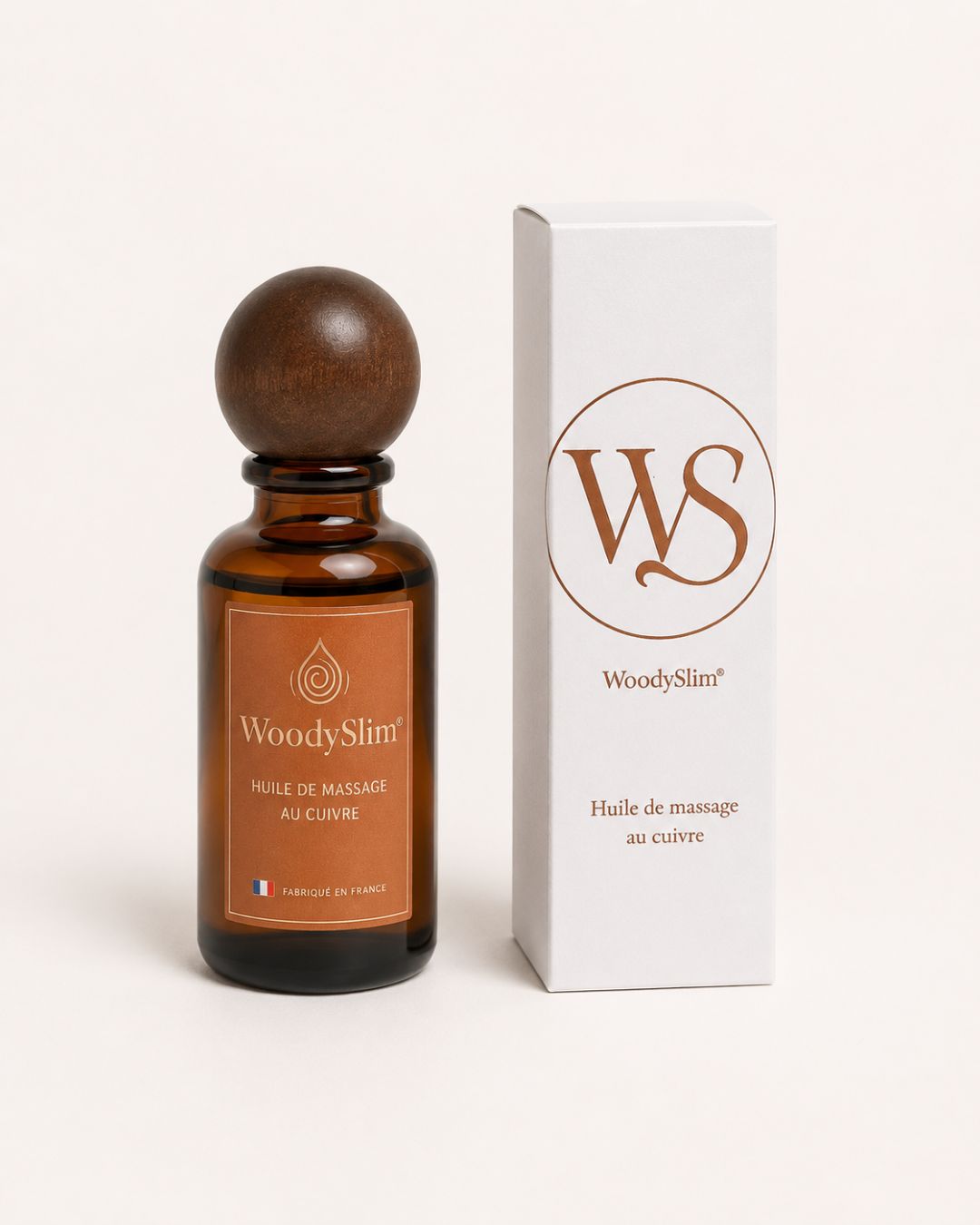 Huile de massage au cuivre WoodySlim avec flacon ambré et étui blanc fabriquée en France.