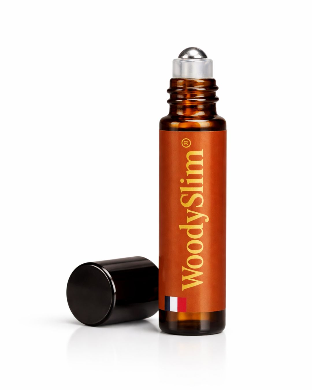 Roll-on WoodySlim à l’huile de rituel au cuivre avec flacon ambré et bille applicatrice.
